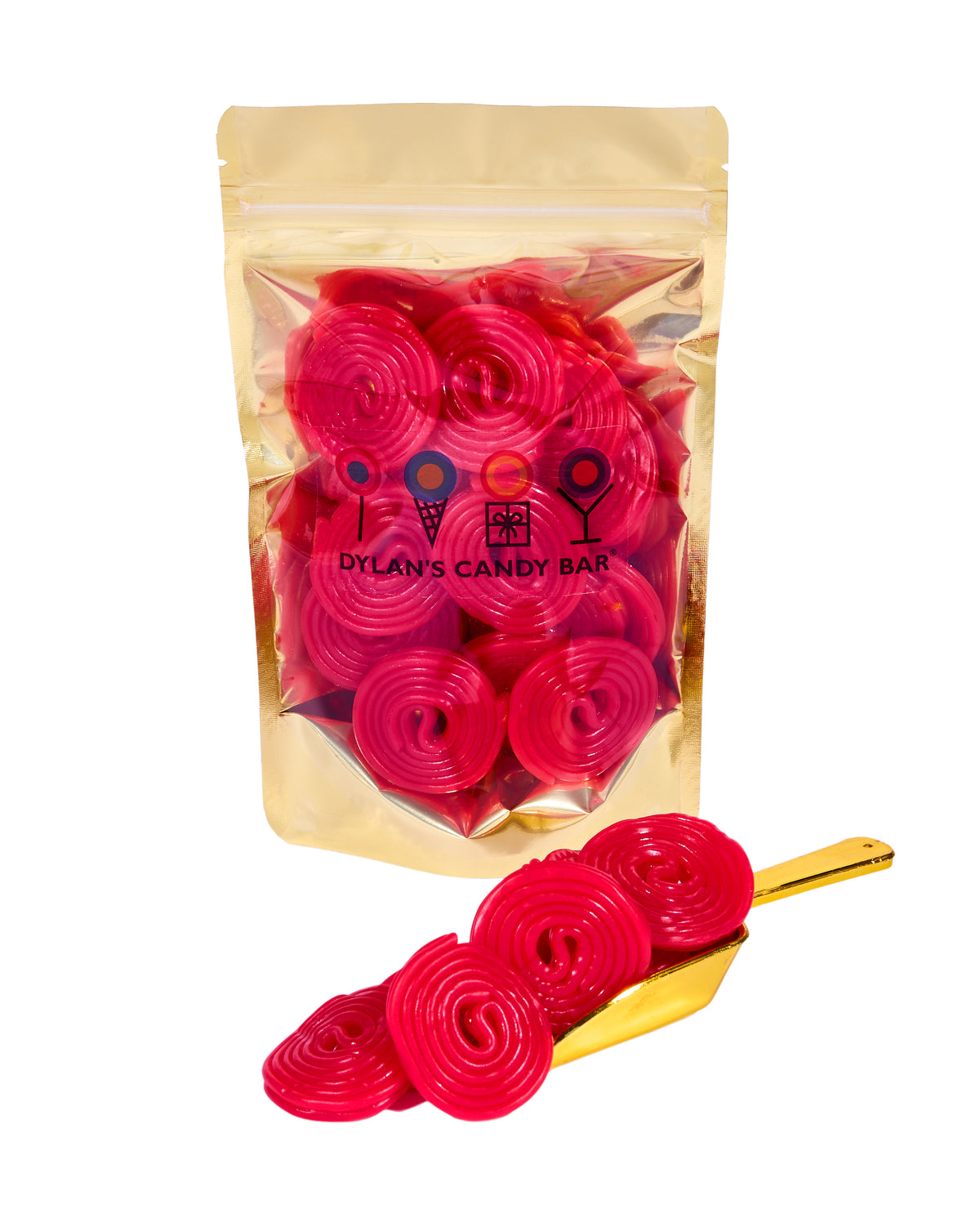 Strawberry Licorice Wheels in resealable gold mylar bag next to Strawberry Licorice Wheels overflowing from gold scoop