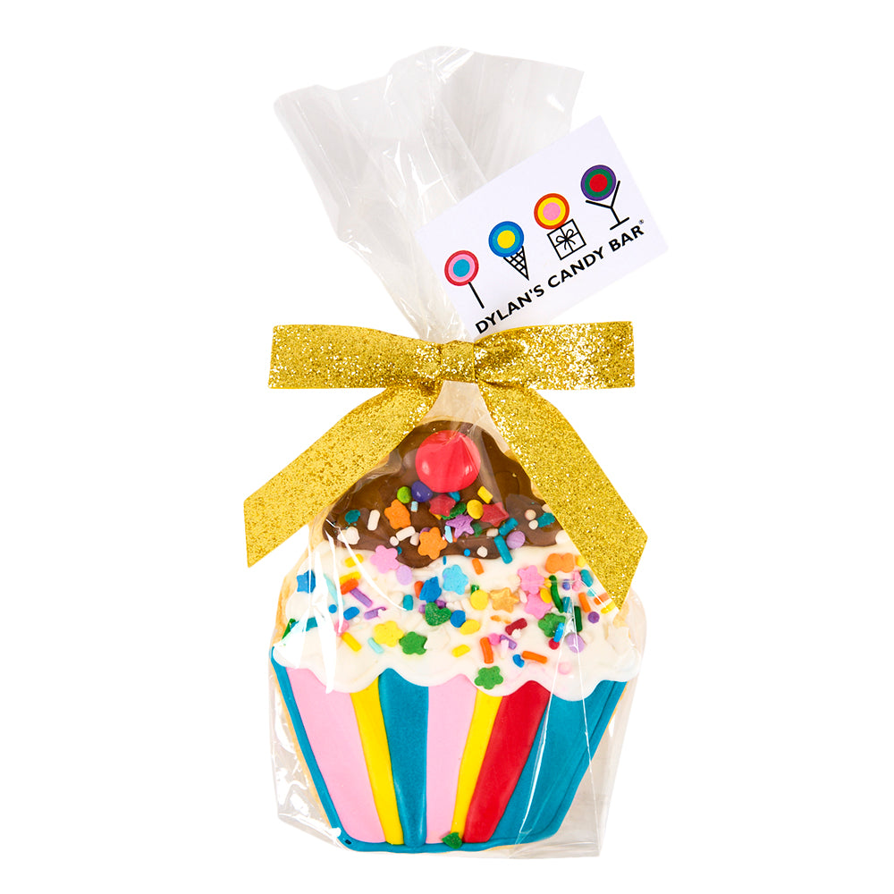 cupcake shaped cookie decorated with frosting and sprinkles and ready to gift with cellophane wrap, gold glitter ribbon and gift tag